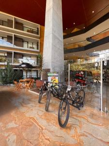 two bikes parked in front of a building at Towers Confort in Rionegro