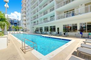 an image of a swimming pool in front of a building at Beautiful Apartments in Miami Brickell in Miami