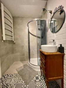 a bathroom with a sink and a shower at Apartament Przytulny 3, self check in, parking in Rzeszów
