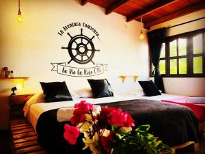 Postel nebo postele na pokoji v ubytování Casa Hostal La Vie en Rose