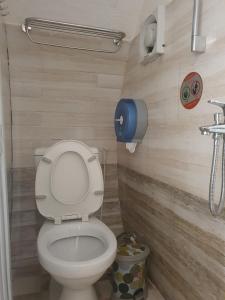 a bathroom with a toilet and a sink at Da Lat LUCINA Boutique Hotel in Da Lat