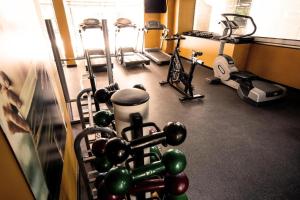 a gym with several exercise equipment in a room at Kubitschek Plaza Hotel - Flat Particular 2 in Brasília