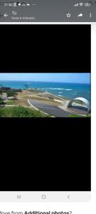 a television screen with a picture of an airport at July in San Felipe de Puerto Plata