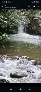 a picture of a river with rocks in the water at July in San Felipe de Puerto Plata