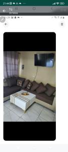 a living room with a couch and a table at July in San Felipe de Puerto Plata