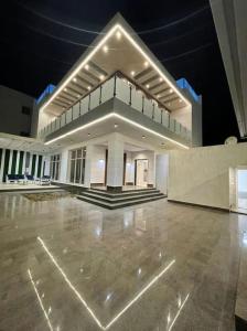 a large white building with a large concrete floor at شاليه رحال in Yanbu Al Bahr