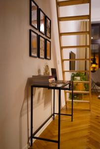 a glass table in a room with a staircase at Art Apartment Bydgoszcz in Bydgoszcz