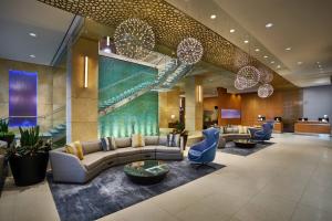 a lobby of a hotel with couches and chairs at The Westin Virginia Beach Town Center in Virginia Beach