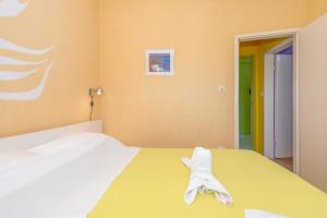 Postel nebo postele na pokoji v ubytování Apartman Petra 5