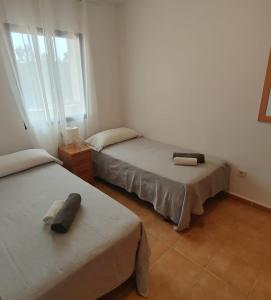 Postel nebo postele na pokoji v ubytování Formentera Suite 5