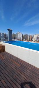 a swimming pool on the roof of a building at Monoambiente Confortable Tucuman in San Miguel de Tucumán