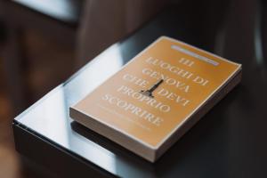 a book sitting on top of a glass table at Il Giardino della Tartaruga in Genova