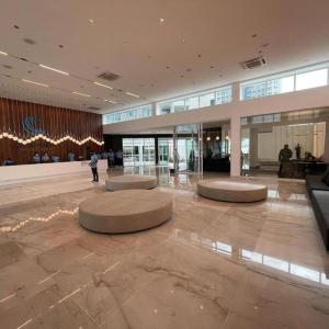 a lobby with circular seating in a large building at Salinas Exclusive Resort in Salinópolis +14 photos