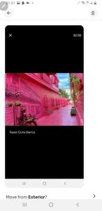 a screenshot of a picture of a pink building at July in San Felipe de Puerto Plata