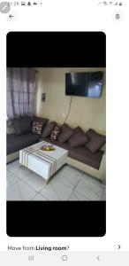 a living room with a couch and a table at July in San Felipe de Puerto Plata