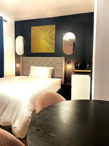 a hotel room with two beds and a table at G Eighty Four in London