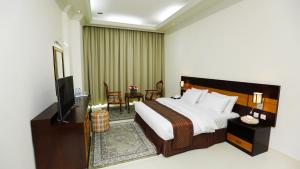 Posteľ alebo postele v izbe v ubytovaní Muscat International Hotel Plaza