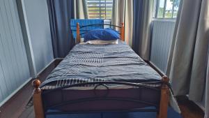 Säng eller sängar i ett rum på Brisbane Budget Homestay