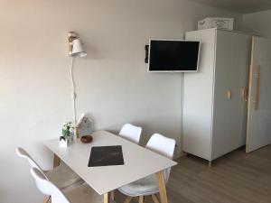 Μια τηλεόραση ή/και κέντρο ψυχαγωγίας στο Ferienwohnung Seeblick Hahnenklee