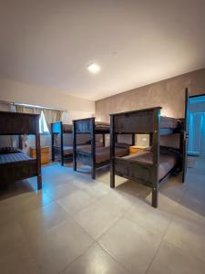 a group of bunk beds in a room at Las Golondrinas Mar del Plata in Mar del Plata