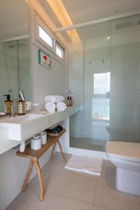 a bathroom with a sink and a shower at Pousada Mar em Mim in Fernando de Noronha