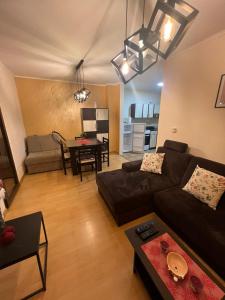 a living room with a couch and a table at Apartman Stefan Zlatibor in Zlatibor