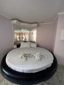 Postel nebo postele na pokoji v ubytování Hotel Paradise