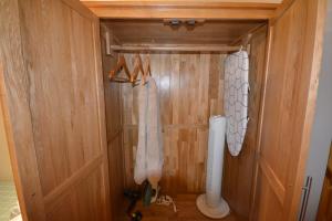 a bathroom with a toilet and a wooden door at 160 Westminster Way,Fab studio room in Oxford