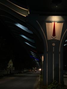 a car driving under a bridge at night at SM Homestays 2 in Tirupati