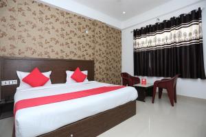 Łóżko lub łóżka w pokoju w obiekcie OYO Hotel Vandana