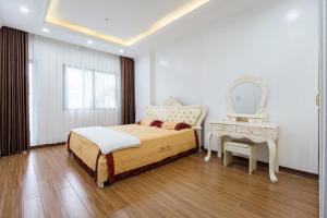 מיטה או מיטות בחדר ב-The Peninsula Haiphong