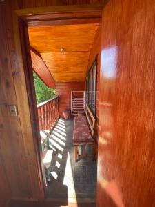 a view of a porch of a house with a bench at Casa Licanray in Licán Ray +12 photos