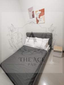 Letto o letti in una camera di THE ACE PAD at SMDC Charm Residences
