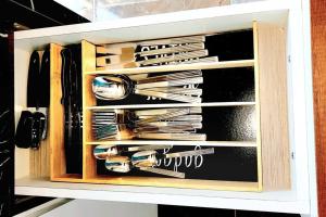 a drawer filled with utensils in a cabinet at RH los ángeles (#3) APT 1er piso in San Juan