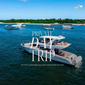 a group of boats floating in the water at Private Yacht Bali to Nusa Penida in Ujung