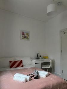 a child laying on a bed in a bedroom at Private Bedrooms in Camden Town, Central London (10) in London