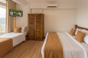 Postel nebo postele na pokoji v ubytování 360 Lake View Hotel + 4 fotografie