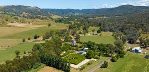 an aerial view of a house in a field at Brookfield Guest House in Myrrhee