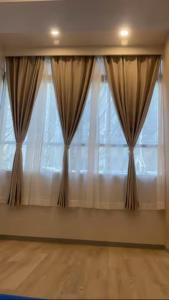 a large window with curtains in front of it at Tokyo Guest 浜町 in Tokyo