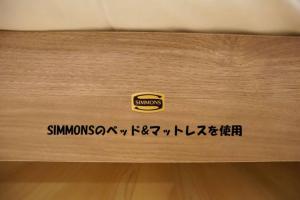 a wooden drawer with a simpsons logo on it at Tokyo Guest 浜町 in Tokyo