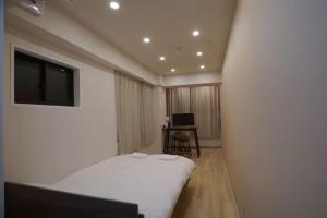 Postel nebo postele na pokoji v ubytování TokyoGuest 浜町