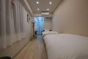 Postel nebo postele na pokoji v ubytování TokyoGuest 浜町