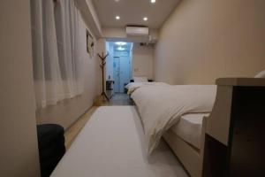 Postel nebo postele na pokoji v ubytování TokyoGuest 浜町
