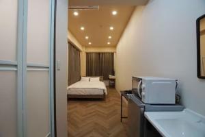 Postel nebo postele na pokoji v ubytování TokyoGuest 浜町