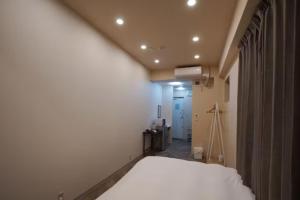 Postel nebo postele na pokoji v ubytování TokyoGuest 浜町