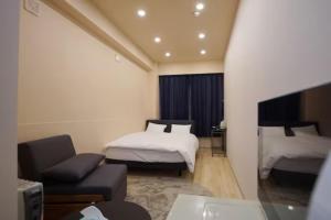 Postel nebo postele na pokoji v ubytování TokyoGuest 浜町