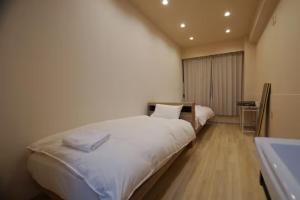 Postel nebo postele na pokoji v ubytování TokyoGuest 浜町