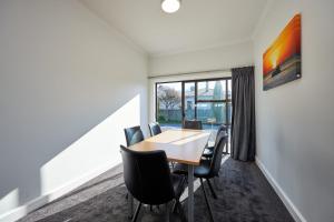a dining room with a table and chairs at Central | Beach Nearby | Parking - KK27622 in Kaikoura