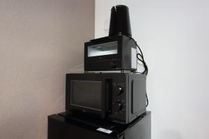 telewizor i aicterotentotentotent w obiekcie サンコート４０２ w mieście Kita-sanjō