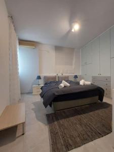 Ένα ή περισσότερα κρεβάτια σε δωμάτιο στο Apartment on the beach